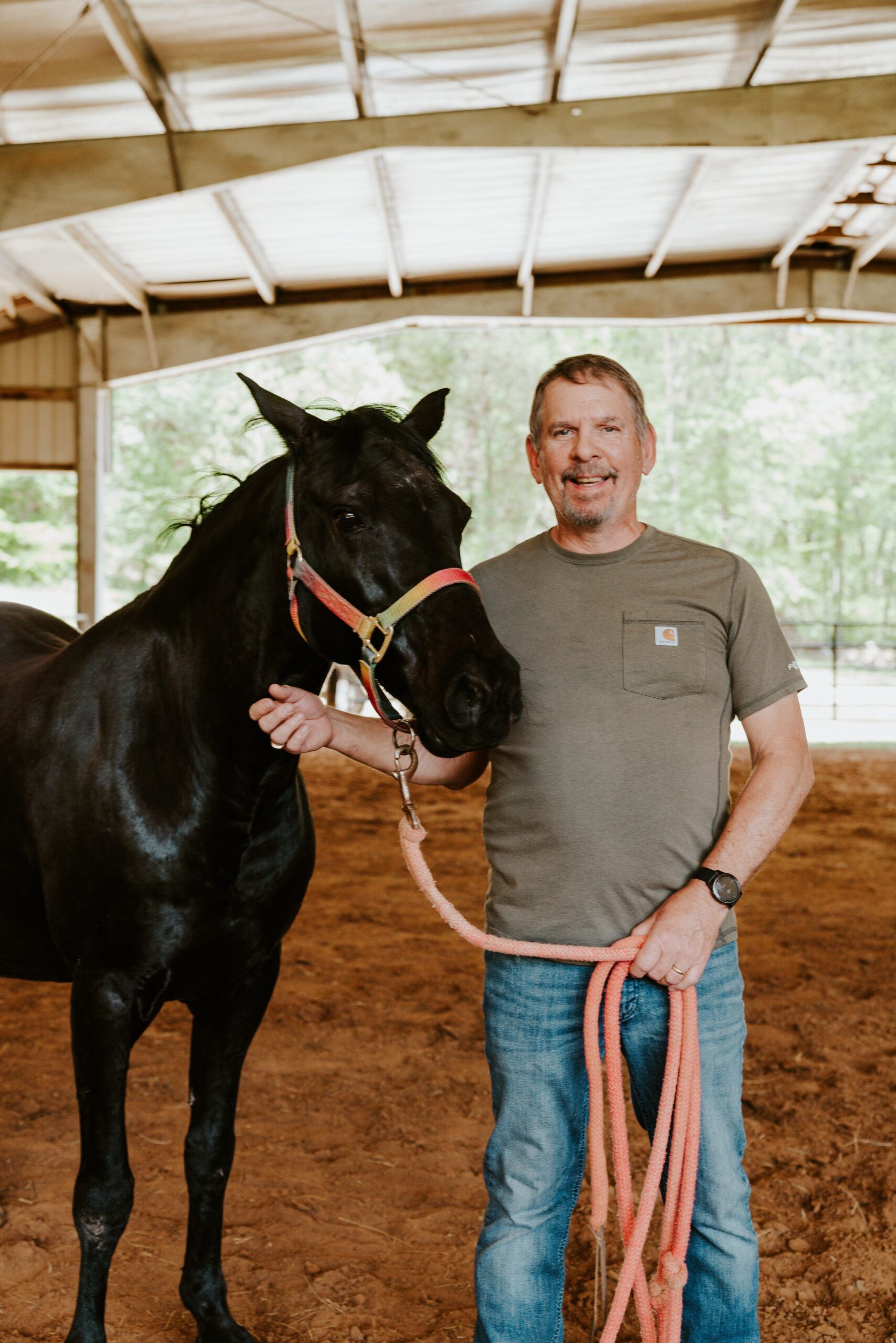 A team member and a horse at The Bridge to Recovery's mental health workshop
